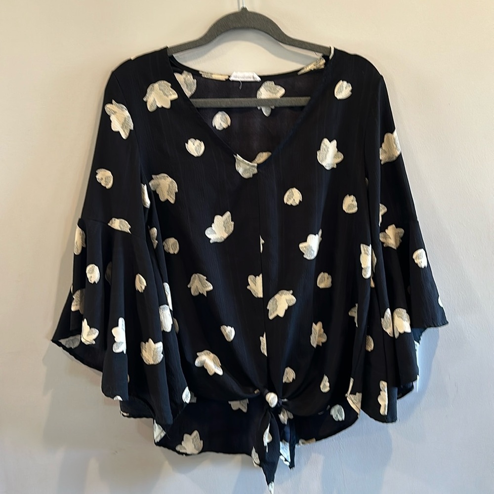 Women’s size medium tulip sleeve tie-front top.